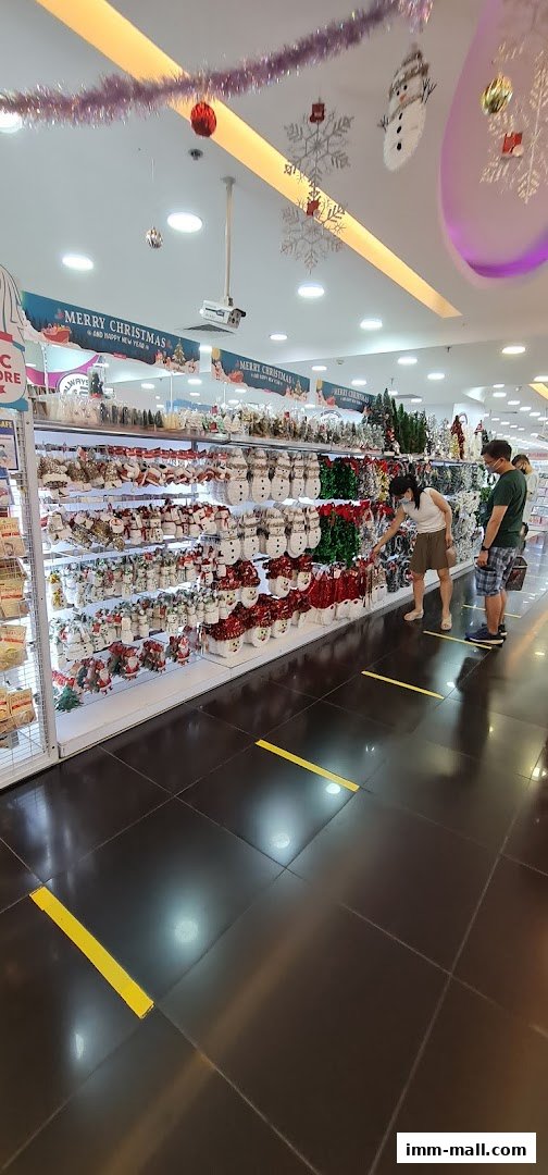 Interior view of a DAISO store with Christmas decorations and merchandise on display.