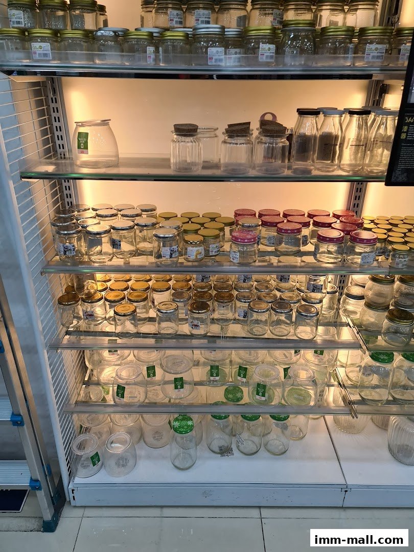Shelves filled with various glass jars and bottles of different sizes and designs.