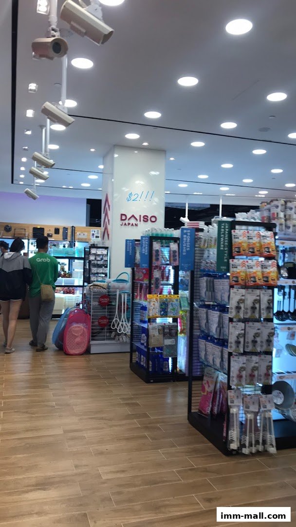 Interior view of a Daiso store showcasing various household items and cleaning supplies.