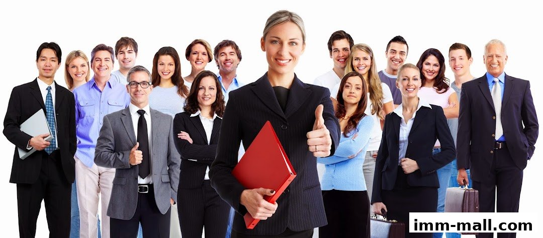A diverse group of professionals posing confidently with a woman giving a thumbs-up.