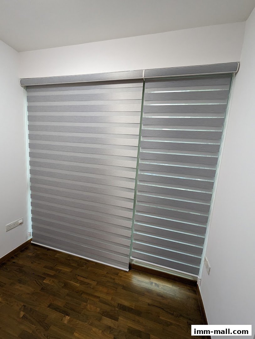 Modern roller blinds with alternating opaque and sheer bands installed on a window.