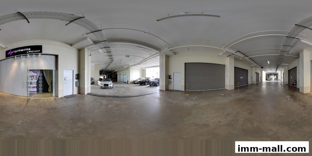 The entrance to Dpatterns Pte Ltd, a shop with a modern facade and interior display.
