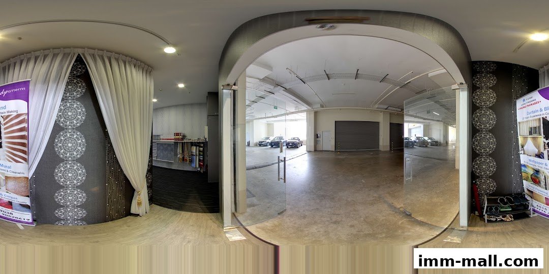 Interior view of Dpatterns Pte Ltd, showcasing curtains, wallpaper, and a view of a parking area.