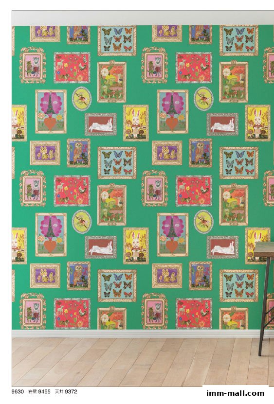 A green wall with a repeating pattern of framed whimsical illustrations.