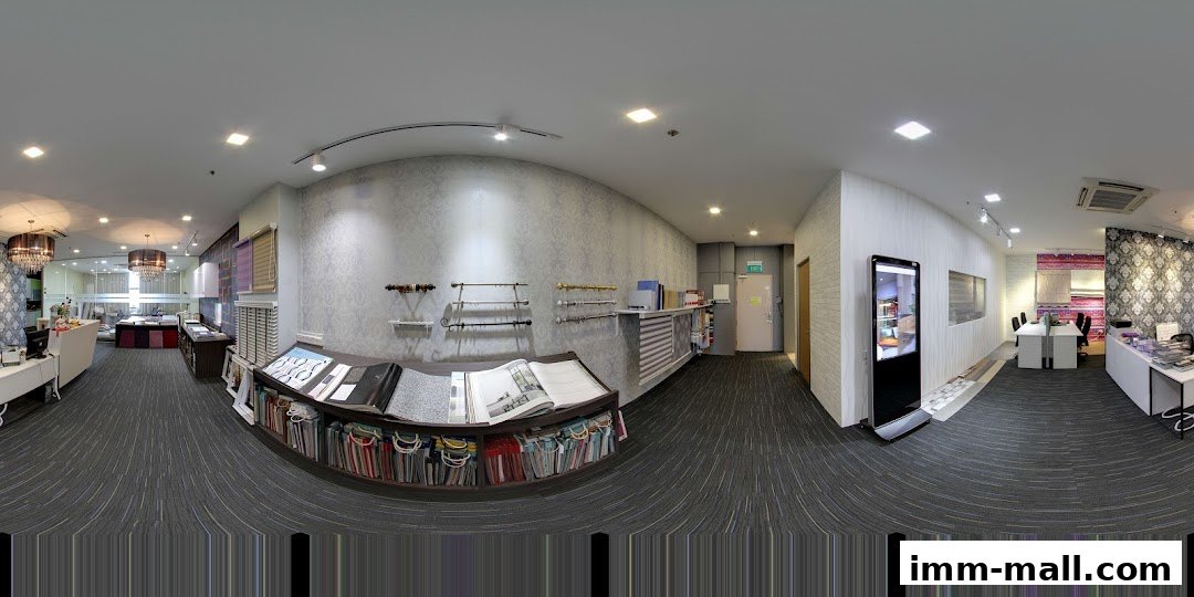 Interior view of a showroom displaying fabric samples and curtain rods.