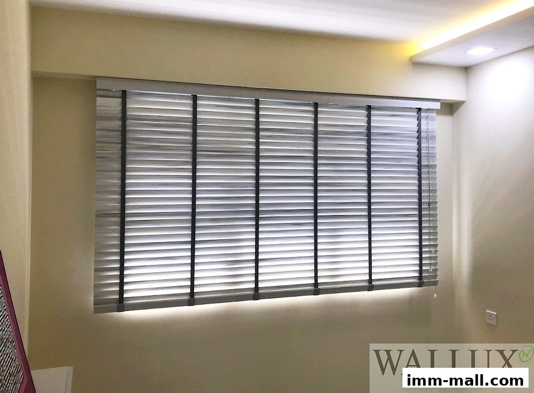 A window with horizontal blinds and subtle lighting, showcasing a modern interior design.