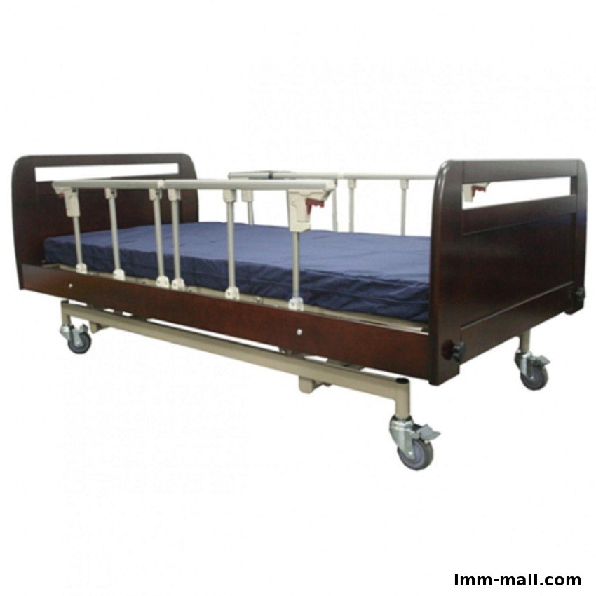 A dark wood hospital bed with a blue mattress and side rails on wheels.
