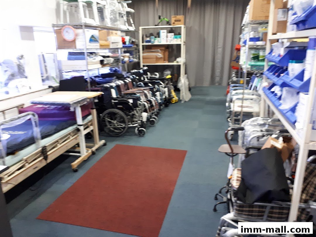 Interior view of a store with medical equipment like beds and wheelchairs.