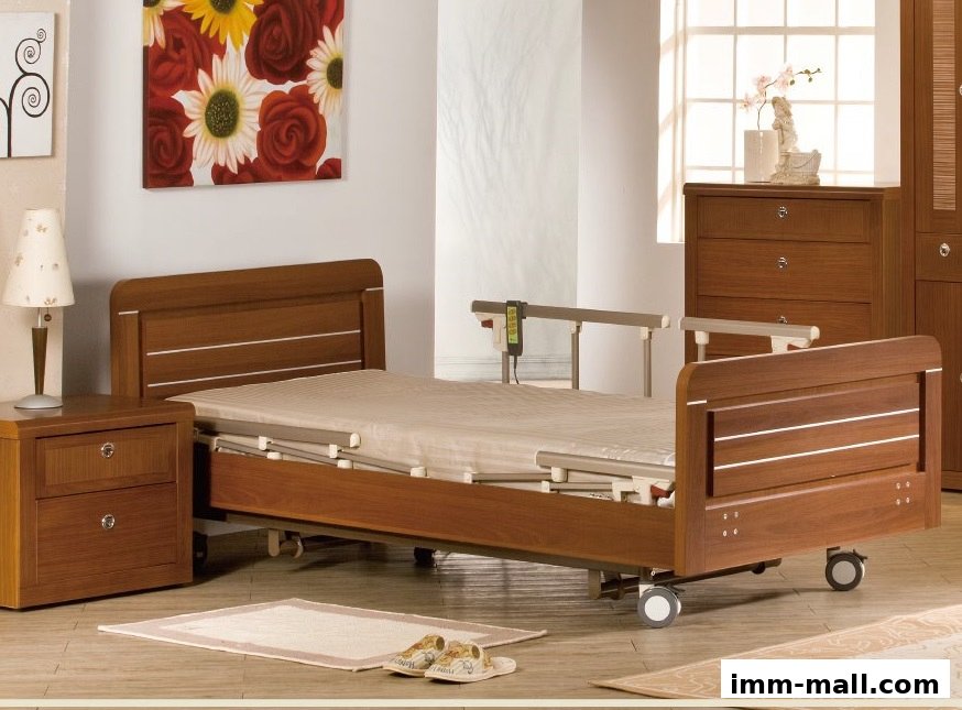A modern adjustable hospital bed with a wooden frame and bedside table.