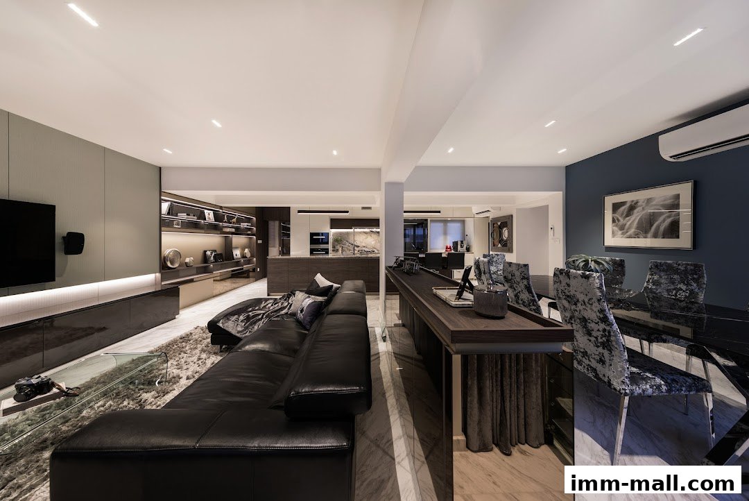 A luxurious modern living and dining area with a black leather sofa and marble dining table.