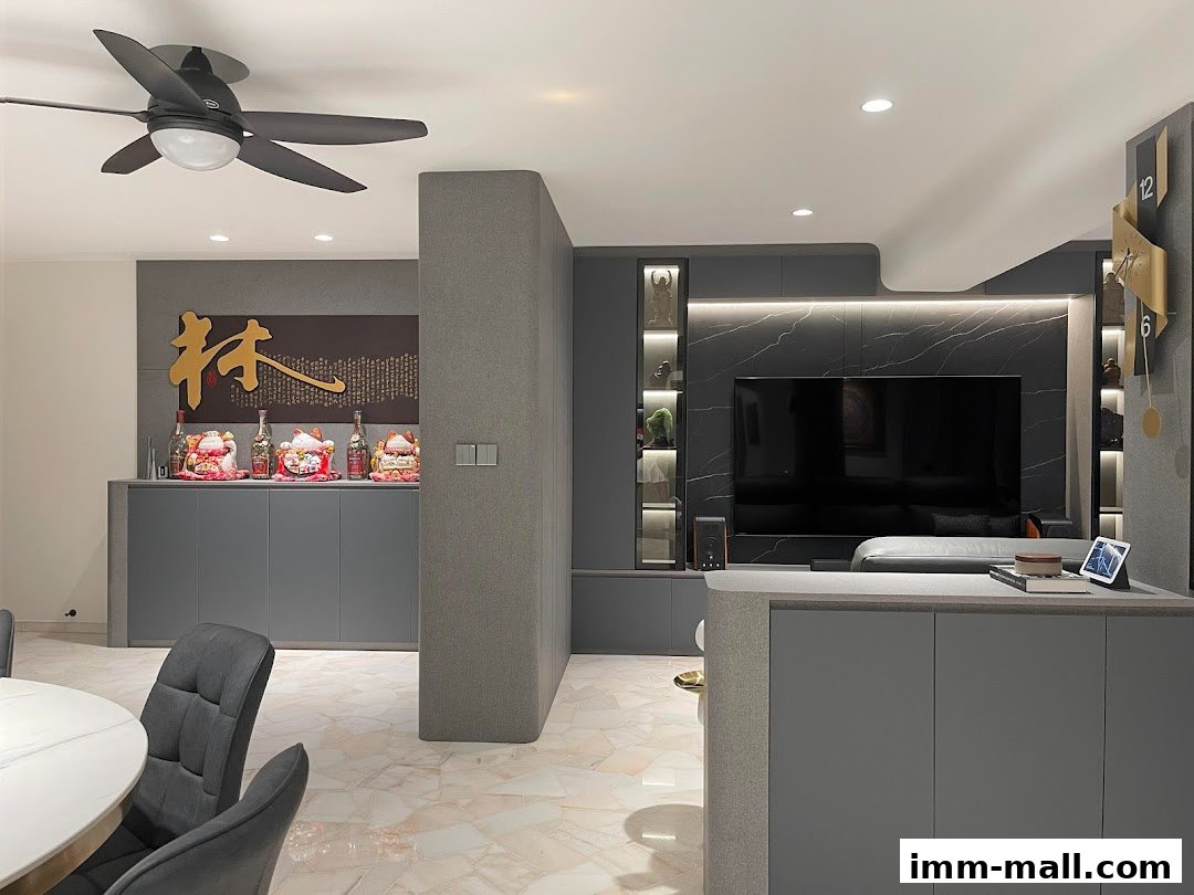 Modern living room with grey cabinets, a large TV, and decorative items.