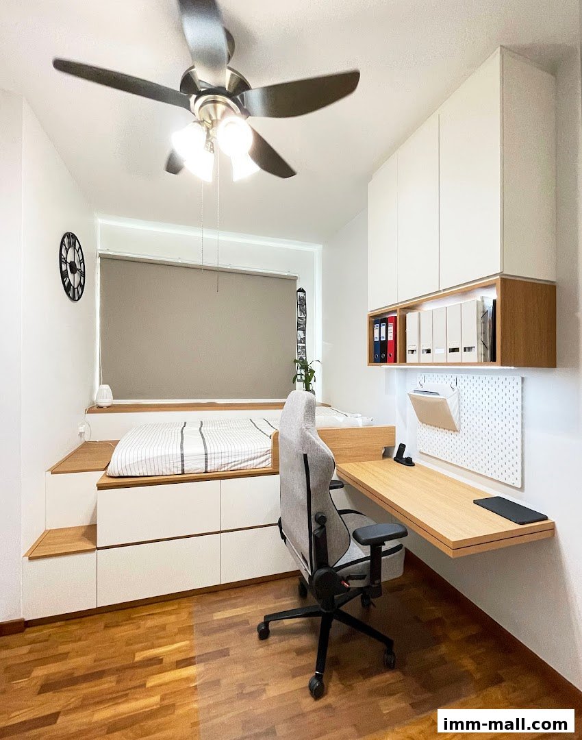 A modern bedroom with a raised bed, desk, and storage solutions.