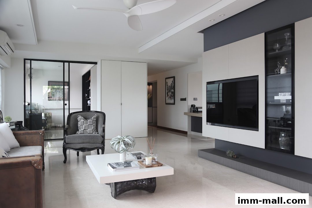 A modern living room with a TV, sofa, armchair, and coffee table.