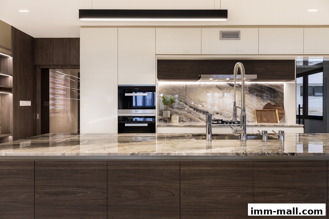 A modern kitchen with marble countertops, dark wood cabinets, and built-in appliances.