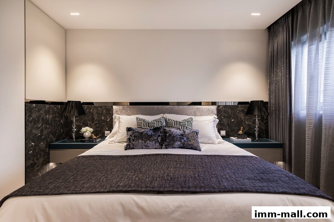 A luxurious bedroom with a king-size bed, plush pillows, and elegant bedside lamps.