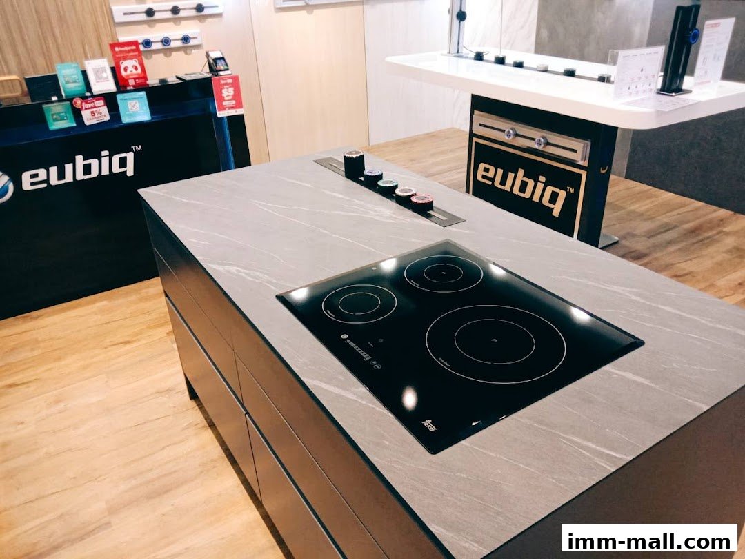 Interior of the Eubiq Concept Store showcasing a modern kitchen island with an induction hob.
