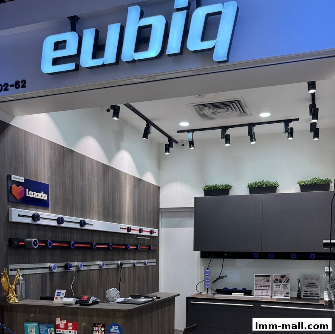 The Eubiq Concept Store features a modern interior with illuminated signage and product displays.