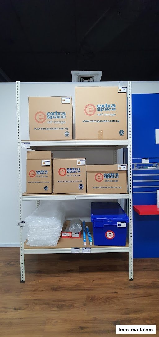 Shelves stocked with various sizes of Extra Space self-storage boxes and packing supplies.