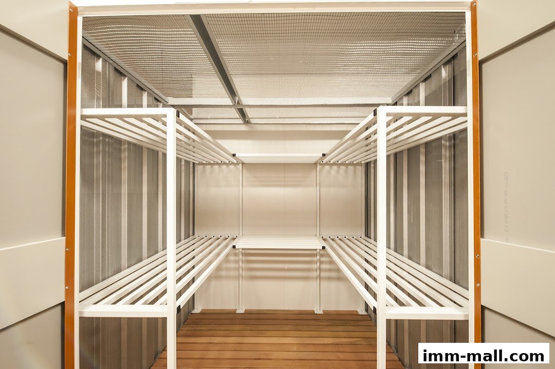 An empty storage unit with white shelves and a wooden floor.
