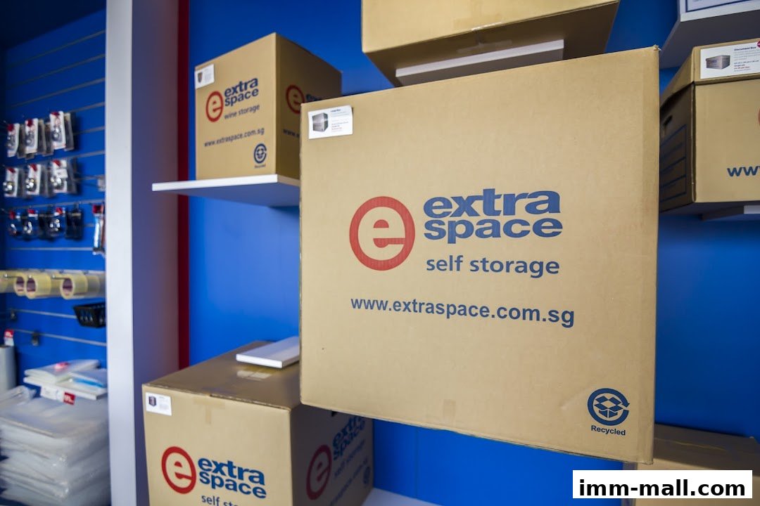 Cardboard boxes with 'Extra Space Self Storage' branding are stacked and displayed.