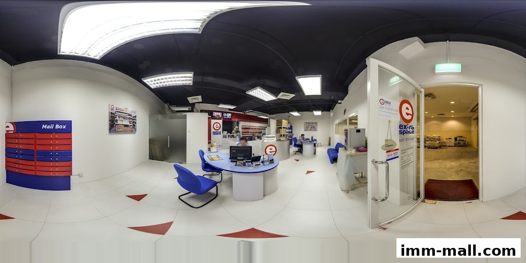 Interior view of Extra Space Self Storage with reception, mailboxes, and storage units visible.