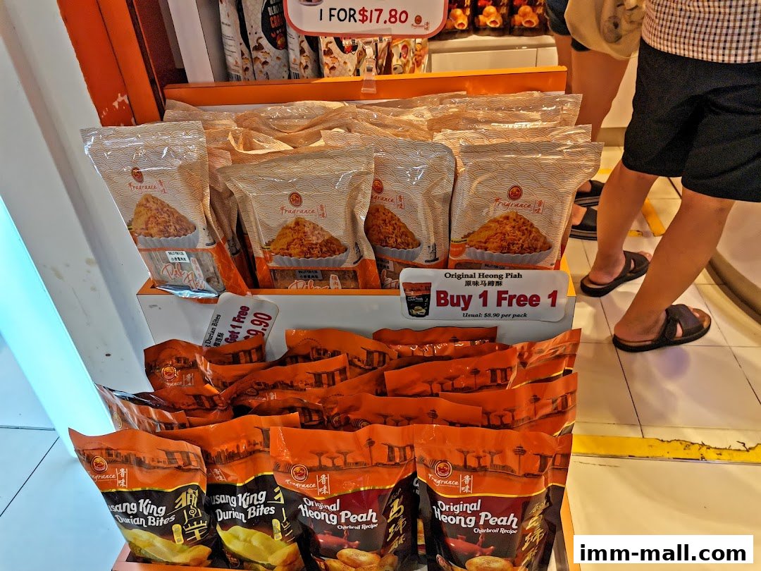 Bakkwa and snacks displayed in a retail shop with a 'Buy 1 Free 1' promotion.