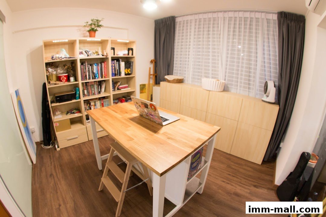 A bright room with a wooden desk, bookshelves, and a laptop.