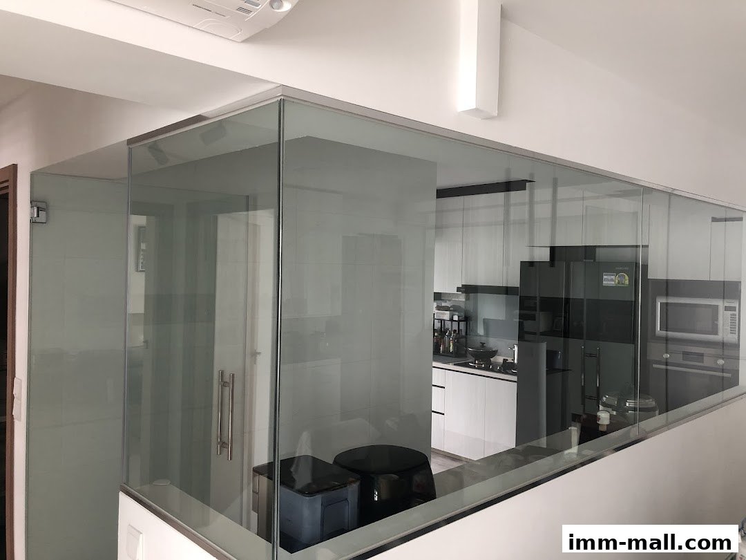 Modern kitchen interior with glass partitions and sleek appliances.