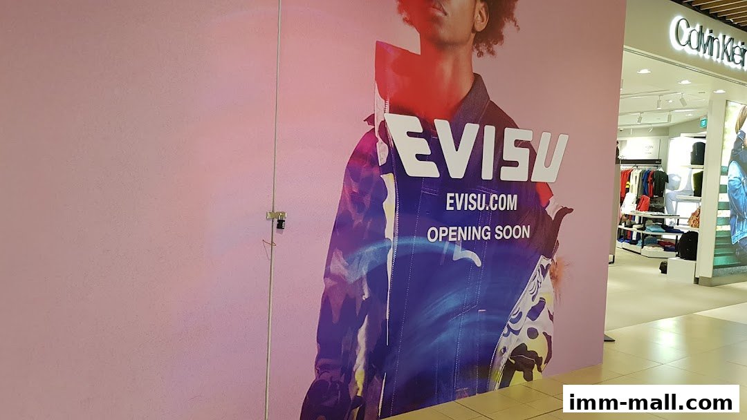 A large Evisu advertisement with 'Opening Soon' text, next to a Calvin Klein store.