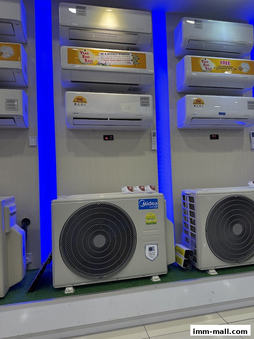 Display of various air conditioning units, including indoor and outdoor units, with promotional signage.