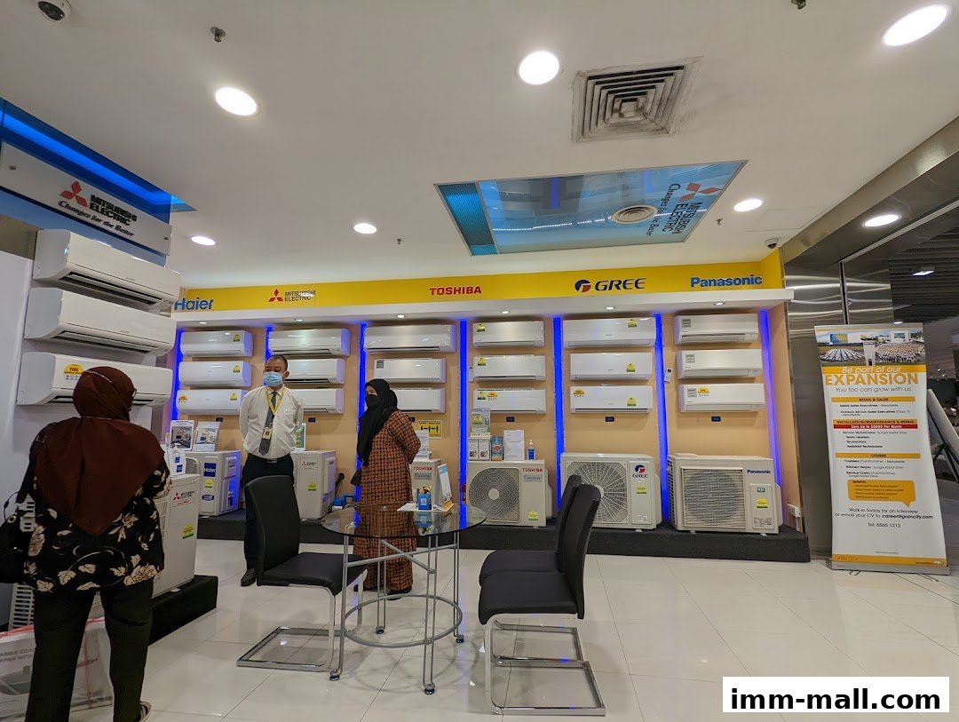 A retail store display featuring various air conditioning units from brands like Haier, Mitsubishi Electric, Toshiba, Gree, and Panasonic.