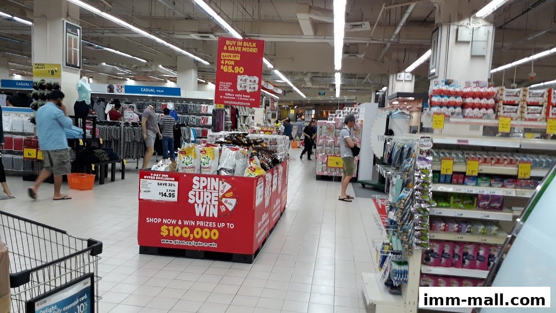 Interior view of a Giant Supermarket with aisles of products and shoppers.
