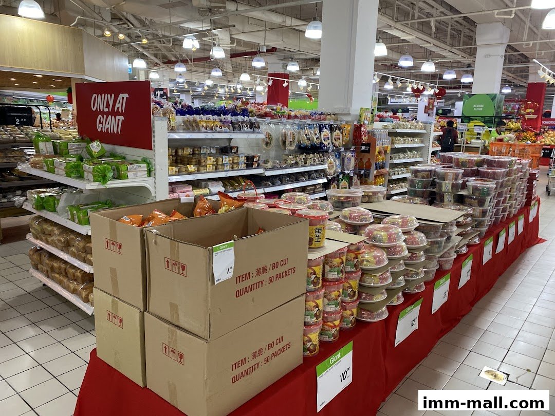 Interior view of Giant Supermarket with shelves stocked with food items and promotional displays.