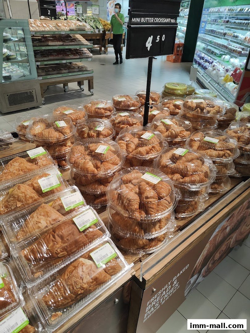 A display of freshly baked croissants and pastries at Giant Supermarket.