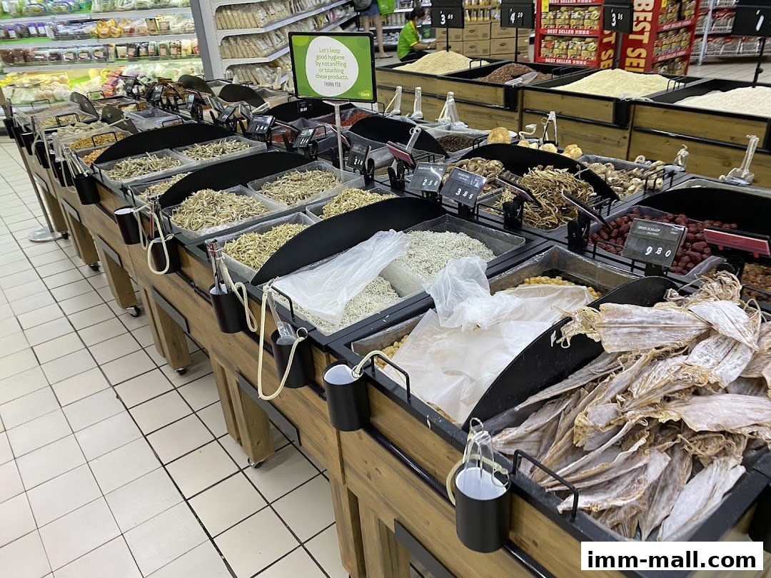 A display of dried seafood and other bulk food items at a supermarket.