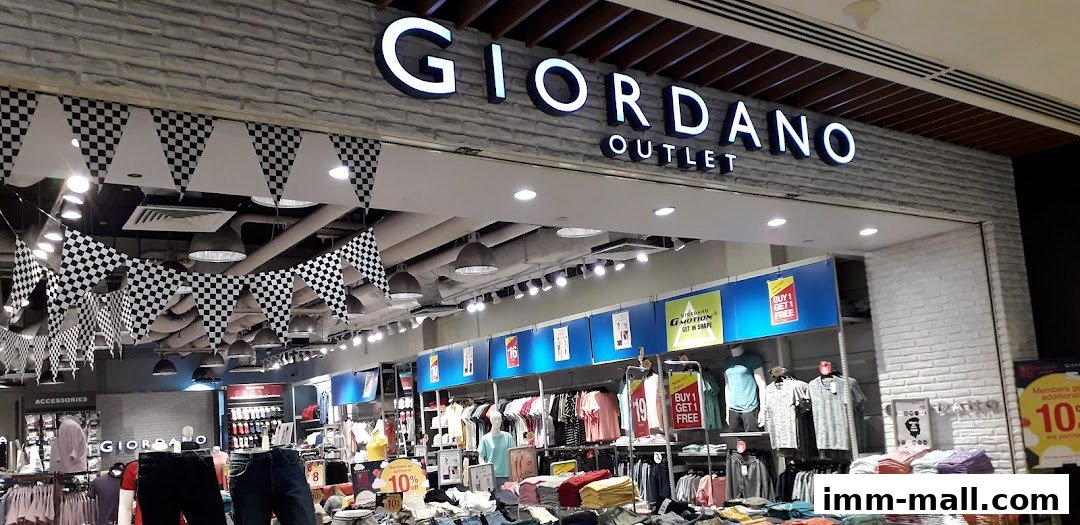 The exterior of a Giordano Outlet store with clothing displays and promotional signage.