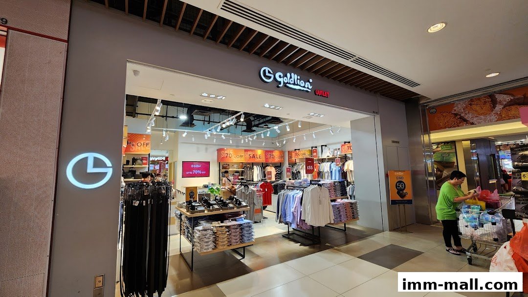 The Goldlion Outlet store entrance with clothing displays and sale signs.