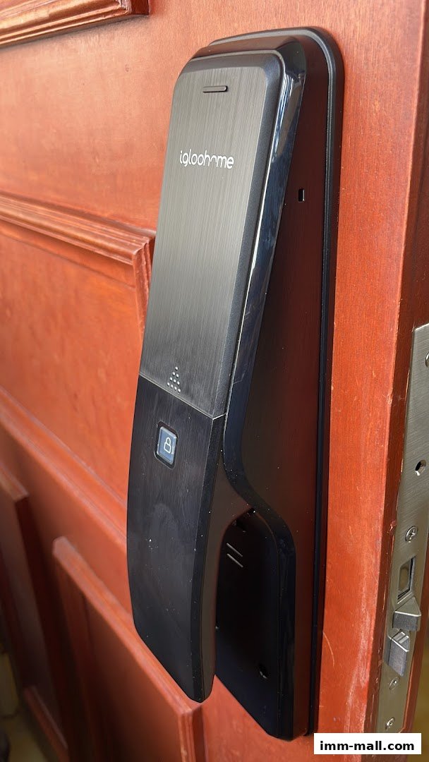 A close-up of a black digital door lock with the brand name 'igloohome' visible.