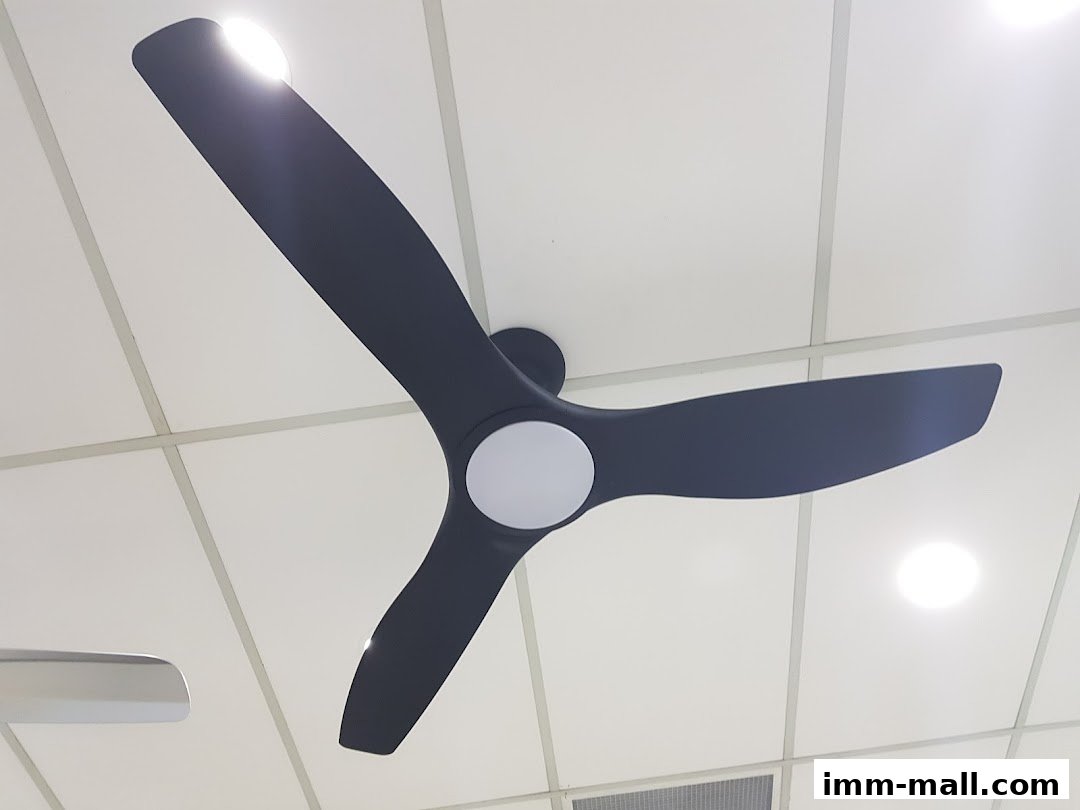 A modern black ceiling fan with three blades and a central light fixture.