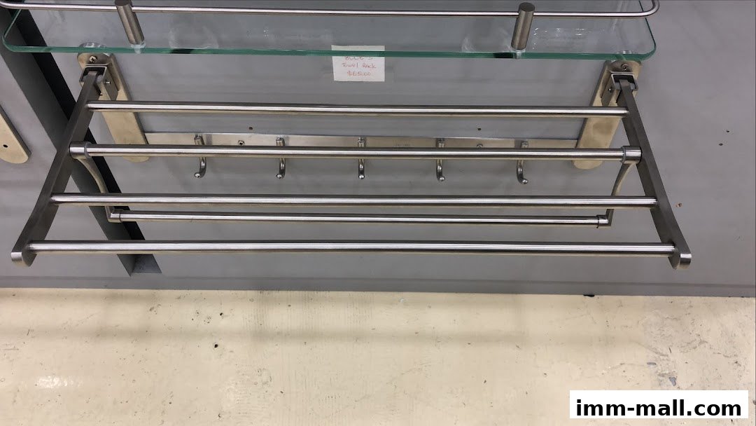 A stainless steel towel rack with a glass shelf and hooks is displayed.