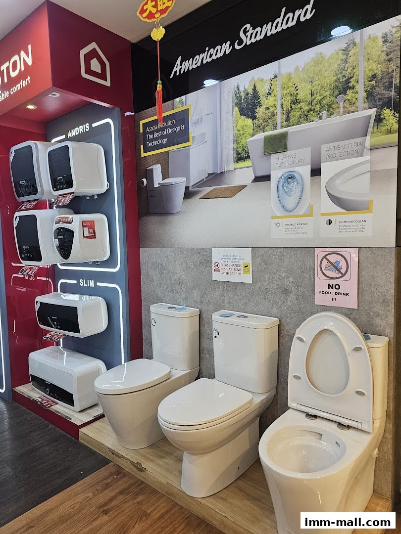A showroom display featuring various water heaters and toilets from American Standard.