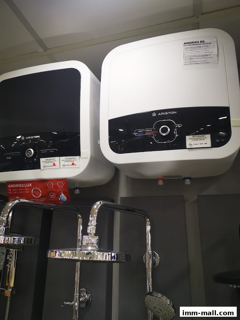 Two Ariston water heaters and shower fixtures are displayed in a retail store.