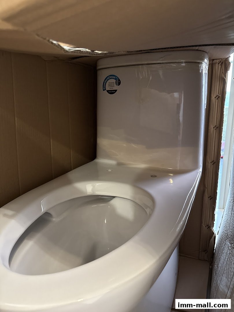 A close-up view of a new white toilet bowl inside its packaging.