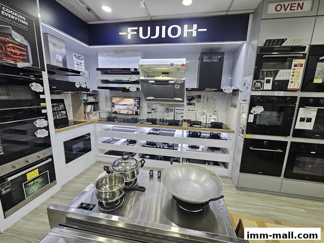 Interior view of a Fujioh appliance showroom displaying ovens, cooktops, and range hoods.