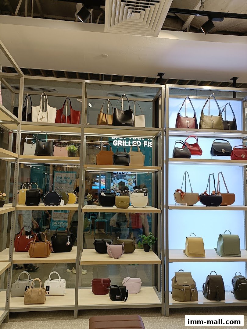 A display of various Hush Puppies handbags and backpacks on shelves.