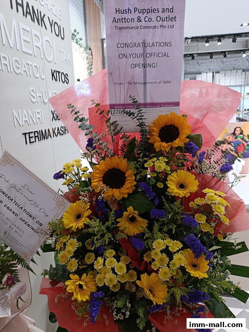 A floral arrangement congratulating Hush Puppies and Antton & Co. Outlet on their official opening.