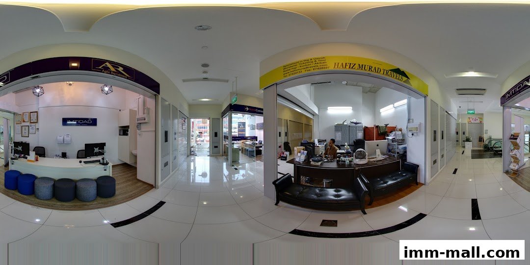 Interior view of Imtidad Jurong IMM Branch and adjacent travel agency.