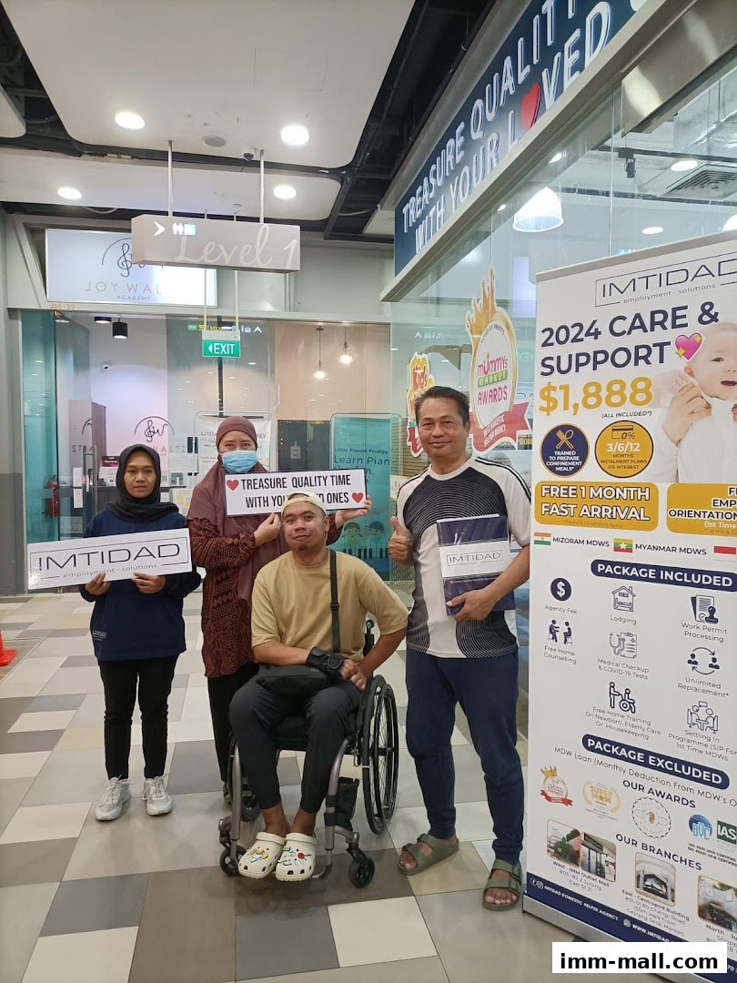 A group of people holding signs for Imtidad, promoting their services.