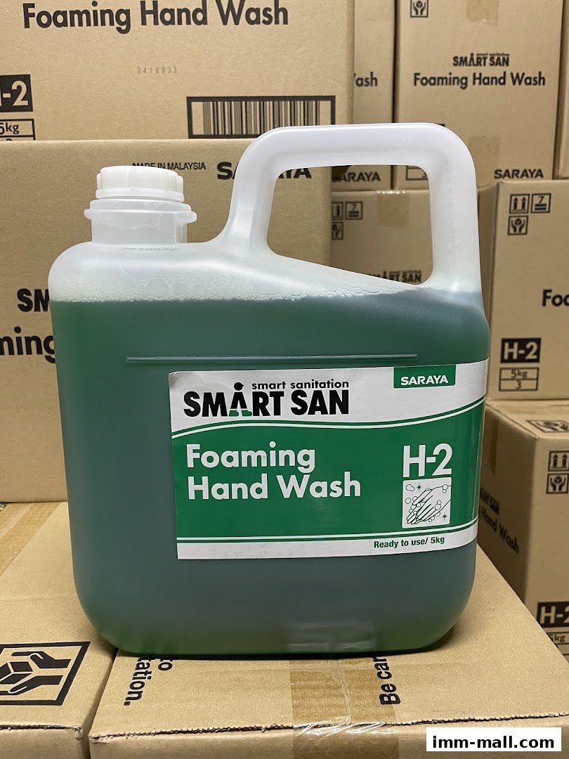 A large container of green foaming hand wash with the brand 'SMART SAN' prominently displayed.