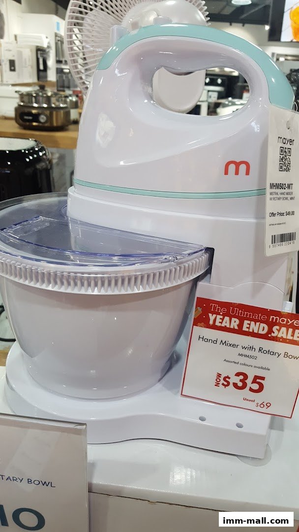 A white and mint green hand mixer with a rotary bowl is displayed with a sale tag.